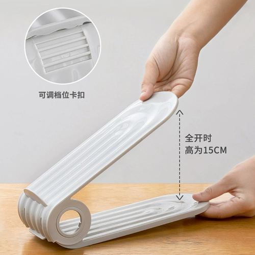 Артефакт хранения двойной стойки для обуви может регулировать шкаф для обуви.