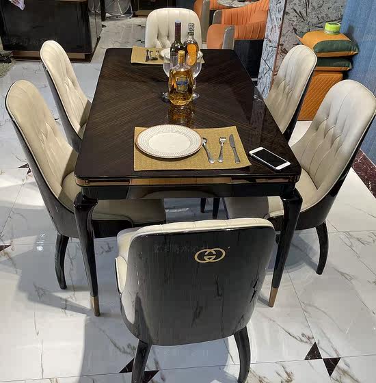 Italian light luxury solid wood leather Bentley dining table and chairs American post-modern Hong Kong-style villa high-end luxury long dining table and chairs