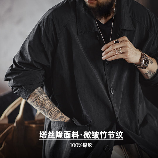 Maden's black windbreaker