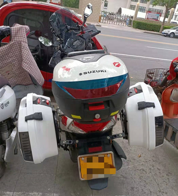 Suzuki UY125 saddlebag tail rack guard