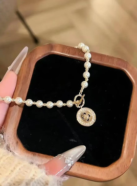 星语纽扣施家珍珠项链女款小众配饰毛衣链夏季轻奢高级感颈链饰品