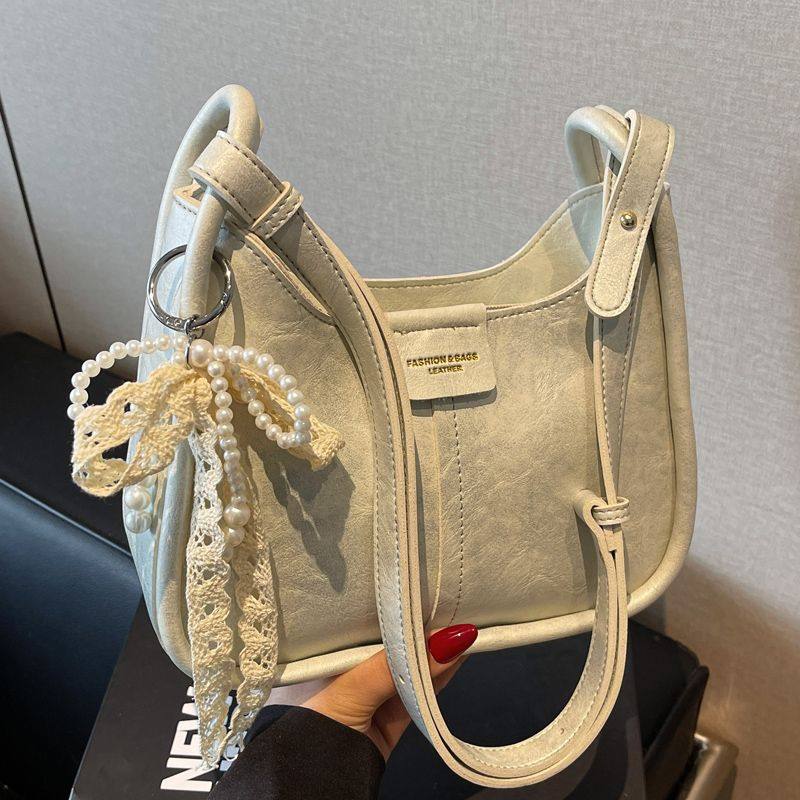 小众设计包包女2025春夏新款韩版大容量单肩腋下包百搭斜挎水桶包,淘宝优惠券,粉丝福利购,淘宝优惠卷