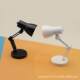 Miniature desk lamp can be used to illuminate the scene props