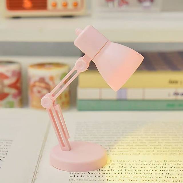 Miniature desk lamp can be used to illuminate the scene props