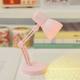 Miniature desk lamp can be used to illuminate the scene props