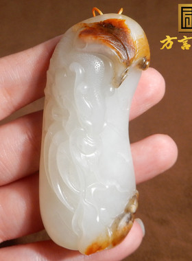 新疆和田玉红沁白玉籽料龙手把件