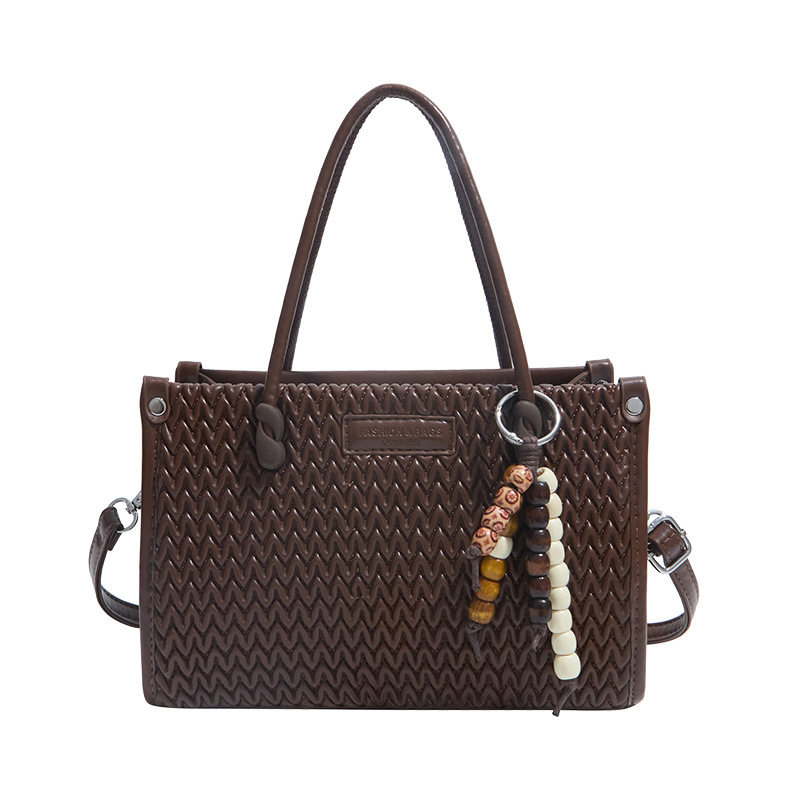 手拎水桶包包女2026新款春季高级感复古小众超火单肩包通勤斜挎包,淘宝优惠券,粉丝福利购,淘宝优惠卷