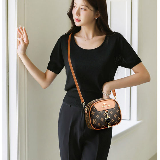 Genuine leather women's small round bag 2026 spring crossbody bag Western style three-layer women's bag old flower material new cowhide small bag
