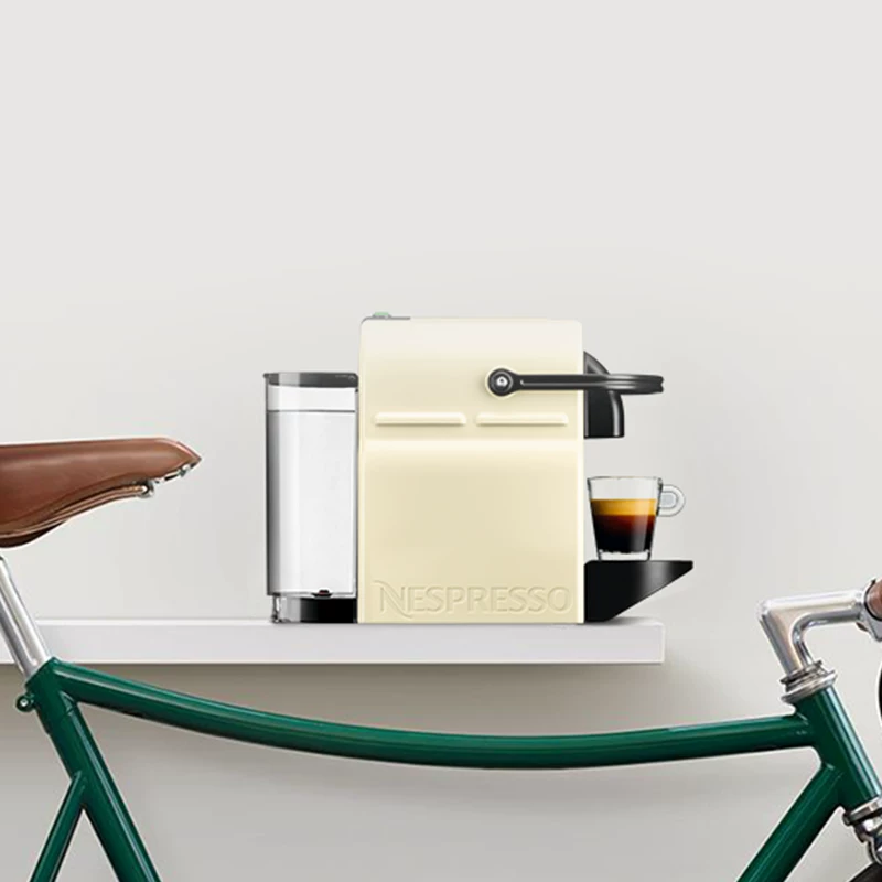 Капельная? Wait. Must translate: "Nespresso fully automatic capsule coffee machine for household small American Italian official Inissia"