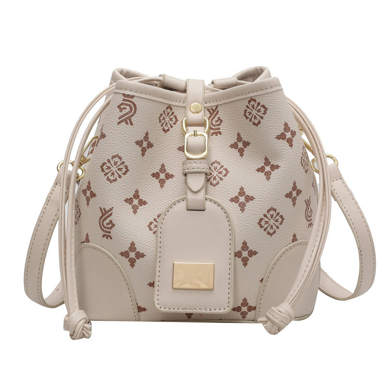 港风复古设计包包女2025新款潮时尚老花斜挎水桶包撞色质感单肩,淘宝优惠券,粉丝福利购,淘宝优惠卷