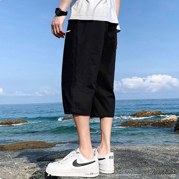 Li Ning cropped pants shorts sports men's sports pants 2024 summer ໃຫມ່ໄວແຫ້ງໄວຊຸດການຝຶກອົບຮົມບາດເຈັບແລະ pants ແລະ sweatpants