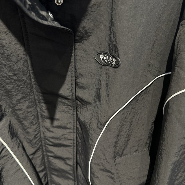 China Li Ning 26 spring and winter new women's loose, warm and comfortable stand-collar casual sports cotton clothing AJMW070