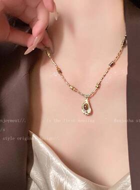 复古美式虎眼石项链女2026新款高级感毛衣链配饰轻奢小众颈链吊坠