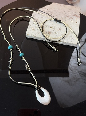 2025秋冬新款毛衣链 雅白银椭圆吊坠皮绳串珠项链长款