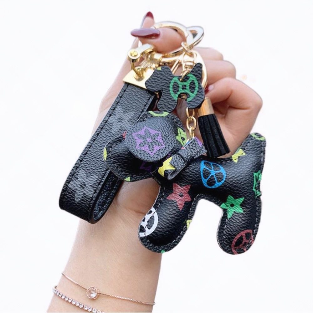 Suitable for LV ladies bag pendant new high-end leather doll bow dog keychain trinket trend