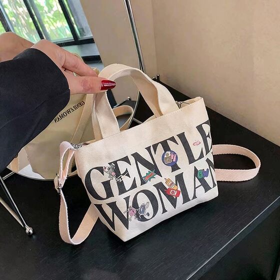 Korean high-end canvas bag for women, small portable bucket bag, mini mobile phone shoulder bag, spring seaside cross-body bag