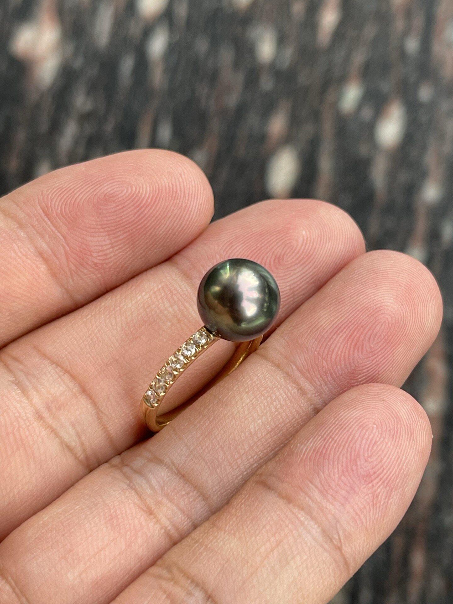 Flawless 10.12mm Tahitian malachite green ring, shot in natural light, set with 9k natural diamonds