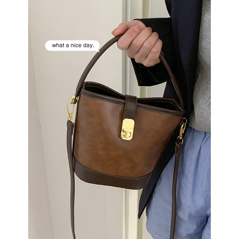 秋冬美拉德手提包包女2023新款潮复古撞色水桶包小众百搭斜挎包,淘宝优惠券,粉丝福利购,淘宝优惠卷