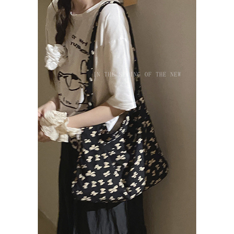 章若楠同款碎花帆布包包女夏天2025新款潮韩国托特包大容量水桶包,淘宝优惠券,粉丝福利购,淘宝优惠卷