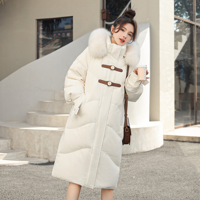 Fox fur collar long down jacket flying in the snow hooded