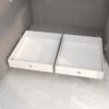 All-white kitchen cabinets with deep cabinets remodeled with basket drawers