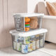Transparent storage box with plastic clothes and toys