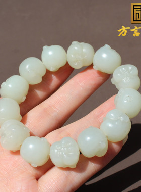 新疆且末料羊脂白玉精雕佛头手串