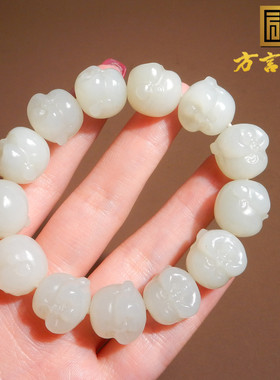新疆且末料羊脂白玉精雕佛头手串