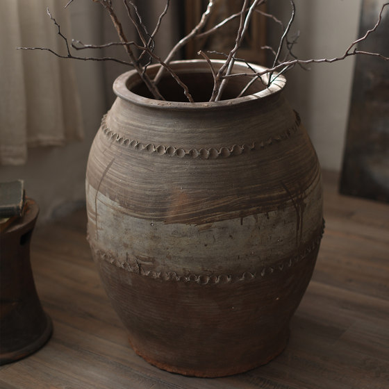 Traditional craftsmanship of old large clay pot vase with texture and large mouth