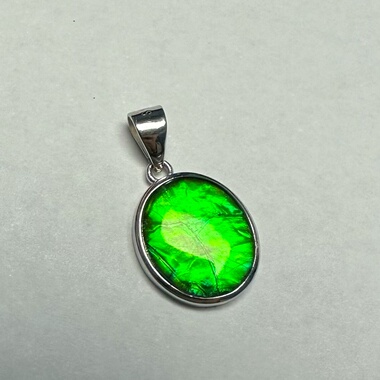 天然加拿大斑彩石12*10mm水晶面椭圆925银吊坠