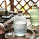 Embossed vintage engraved glass beverage bottle