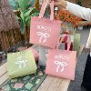 Elegant bow non-woven bag custom-made clothing store bag Internet celebrity hand-held women's shopping bag custom logo