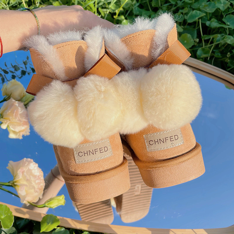 2025冬新款皮毛一体雪地靴女短筒蝴蝶结防滑真皮保暖平底加厚棉靴,淘宝优惠券,粉丝福利购,淘宝优惠卷