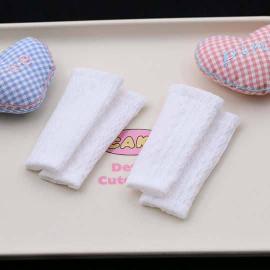 7.5cm long sextet doll legs and piles of socks