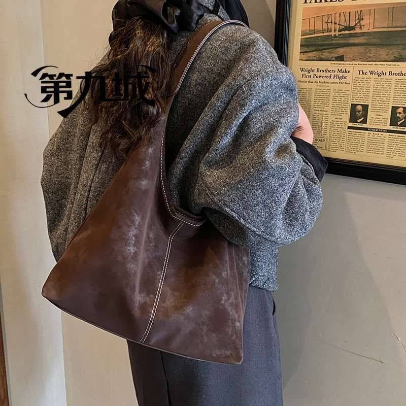 第九城休闲个性托特包2025冬季新款女士包包潮流质感大容量单肩包,淘宝优惠券,粉丝福利购,淘宝优惠卷