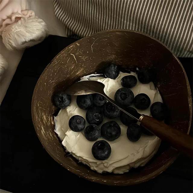 Unlock new ways to eat! Yogurt bowl with spoon coconut bowl dessert salad home breakfast oat coconut shell bowl wooden bowl