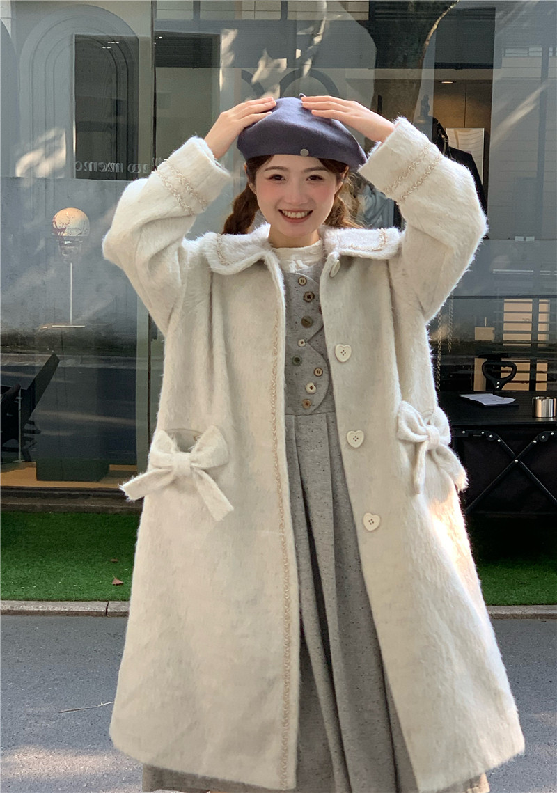 蛋包饭餐厅 米白色爱心扣中长款大衣 10.31 新品95折上架,淘宝优惠券,粉丝福利购,淘宝优惠卷