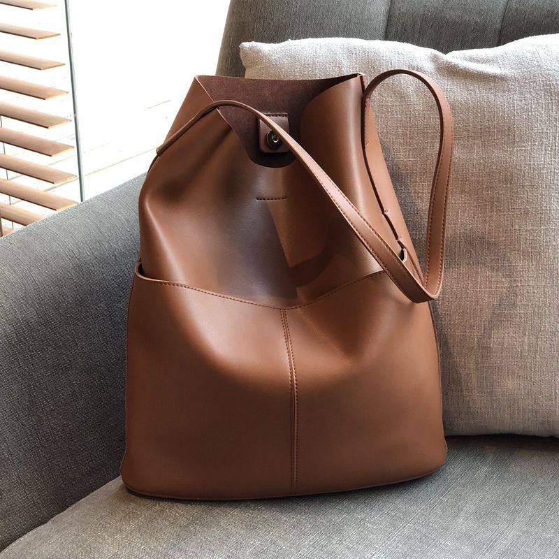 菲色如华新款气质牛皮女休闲水桶包 菲色如华女士包袋