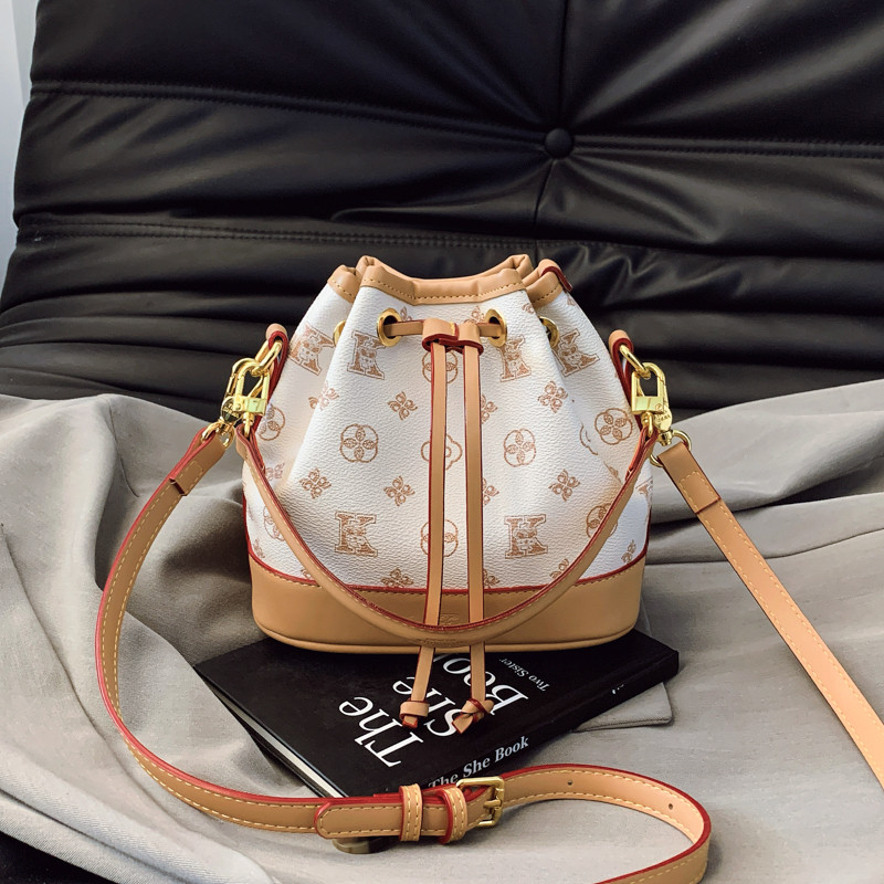 小众设计包包女2025新款时尚老花抽绳水桶包高级感女士单肩斜挎包,淘宝优惠券,粉丝福利购,淘宝优惠卷