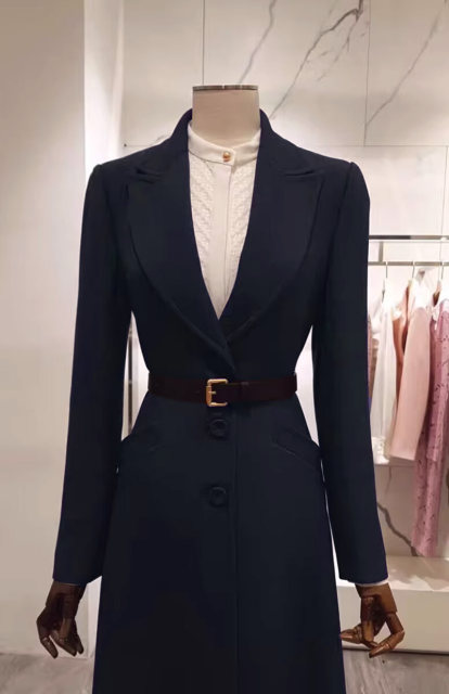 Mid-length, elegant, wide-slung, waist-cinched woolen coat