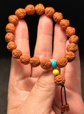 龙纹桃核雕刻小财神手串