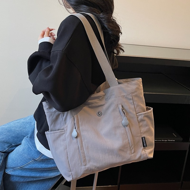 韩版帆布托特包包女2025新款大容量手提通勤包简约百搭休闲单肩包,淘宝优惠券,粉丝福利购,淘宝优惠卷