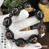 Fidelity Hailiu Wen playing Buddhist beads bracelet