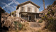 UE5 Unreal, film and television-level high-quality western Gobi town, dilapidated logging houses, rock walls and mud road scenes