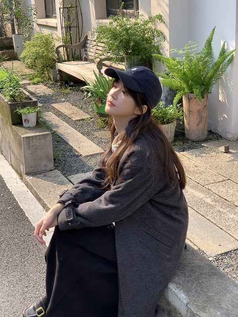 This is a mid-length woolen jacket