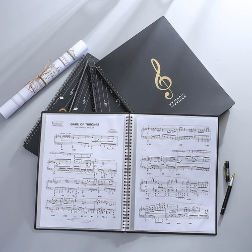 Папка, гитара, черное вместительное и большое пианино, отрывной лист