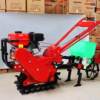 Diesel chain rail Little Red Bull micro-tiller self-propelled orchard tiller vegetable field ditching tiller household earth cultivator