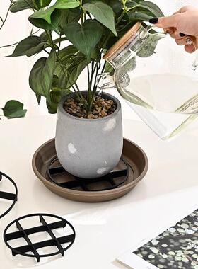 Elevated tray for plant pots to prevent root rot, with a rai