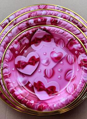 A variety of Valentine's Day plates featuring pink floral an