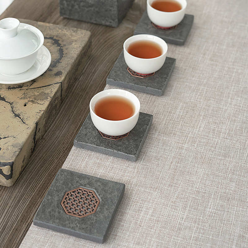 Black gold stone tea mat coaster Zen kung fu tea set accessories stone coaster insulated Japanese simple style direct supply from the manufacturer